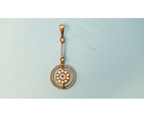 An Edwardian gold pendant set aquamarine and seed pearl cluster within knife edge circlets below pearl set elongated loop, 40