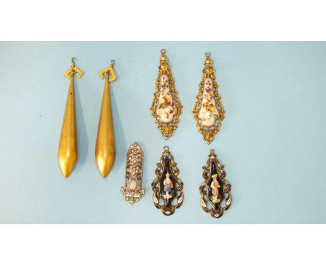A pair of 19th century Swiss enamel earring pendants depicting male and female figures in national costume within enamelled g