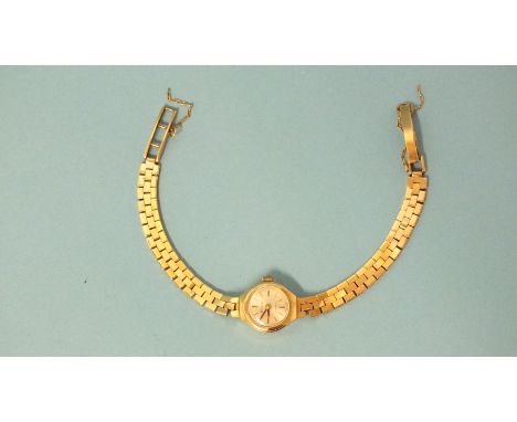 A lady's Accurist 9ct gold cased wrist watch on 9ct gold integral brick-link bracelet, 15.4g.