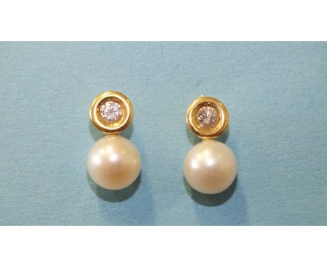 A pair of diamond and pearl earrings, each collet set a brilliant cut diamond with cultured pearl below in 18ct yellow gold m
