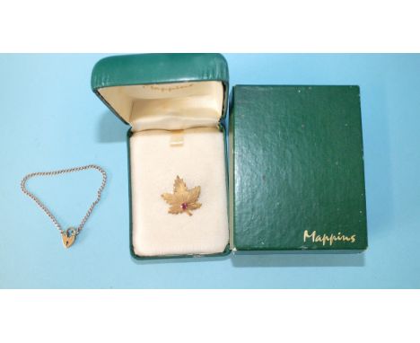 A 9ct gold curb link bracelet with padlock clasp, 2.6g, and an unmarked maple leaf brooch set ruby in Mappins case and box.