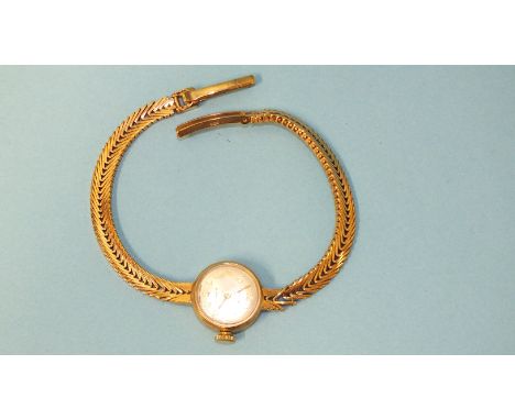 A lady's Accurist 9ct gold cased wrist watch on 9ct gold chevron bracelet, (not working), 16.6g.