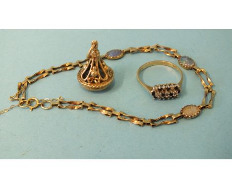 A 9ct gold fob seal set citrine, a small 9ct gold gate link bracelet set opal triplets and a 9ct gold cluster ring, (3).