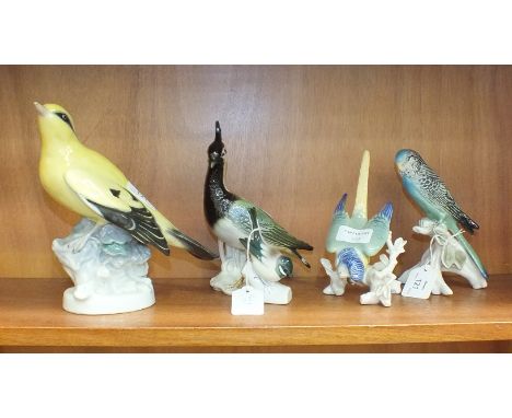 A Karl Ens porcelain model of a budgerigar, numbered 7633, a parrot, a lapwing no.7558 and two others, (5).