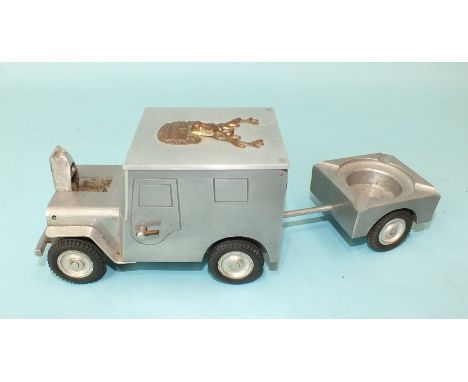 A novelty table lighter in the form of a jeep and limber, c.1940's, by Walter Baier, made in aluminium, the jeep with label t