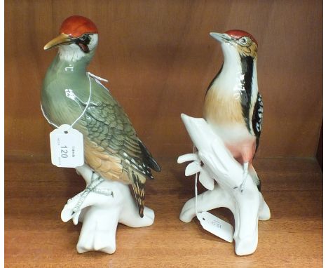 A large Karl Ens porcelain model of a green woodpecker, printed mark and impressed 7527P, 26cm high and another, a spotted wo