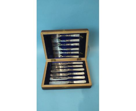 A silver plated oval basket, various plated cutlery, a set of six mother of pearl handled fish knives and forks and miscellan