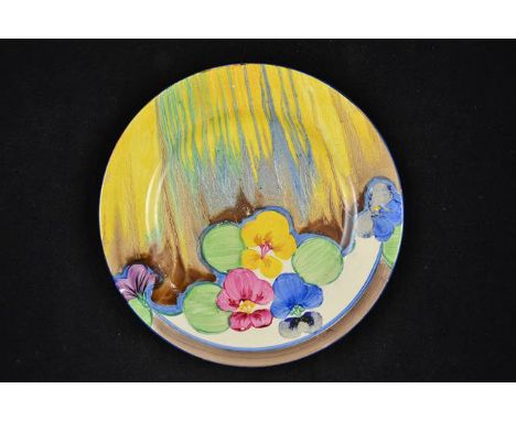 A Clarice Cliff Delicia Pansy pattern plate, marked Bizarre to base - diam 22.5cm CONDITION REPORT: some paint loss to petals