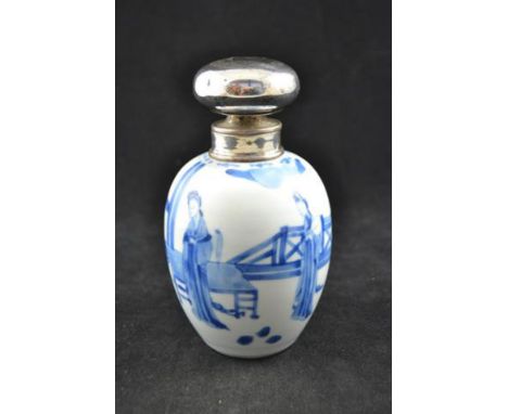 A Late 19th/early 20th Century Chinese white metal mounted porcelain tea caddy decorated in blue with three ladies in domesti