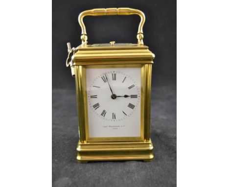 A Charles Frodsham early 20th century brass cased repeater carriage clock, bevelled oval glass to top, dial and back plate nu