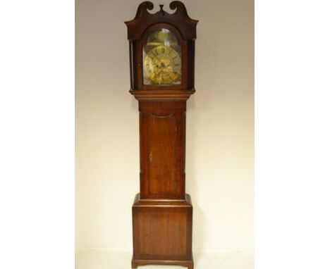 A late 18th/early 19th century oak and mahogany longcase clock with arched brass dial, date aperture, arch inscribed Corrie, 