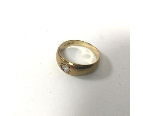 A 9ct gold ring with gypsy set diamond (R) (3.42g)