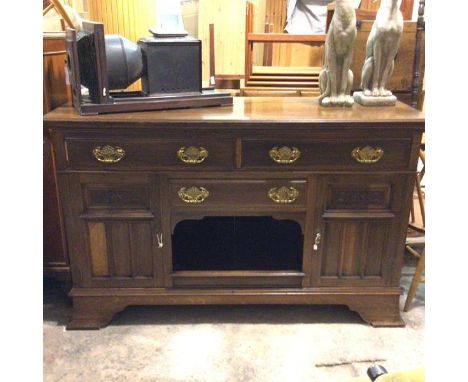 An Edwardian sideboard base, the rectangular top with moulded edge above two frieze drawers, above a centre drawer and open w