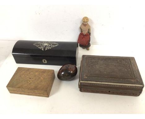 A mixed lot including an Anglo Indian carved box, a box, probably ebony with mother of pearl inlay, a further box, a stone po