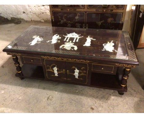 A modern Chinese coffee table, with rectangular glass top above a mother of pearl inlaid scene of Female figures Dancing and 