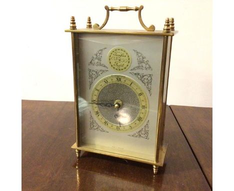 A 1960s carriage clock with roman numerals, inscribed Tempus Fugit and Dominion (24cm)