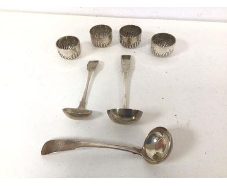An 1815 Scottish silver ladle, a Georgian silver ladle and a set of five London silver gadrooned pots (combined: 138g) and an