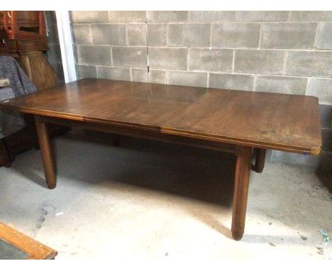 An Art Deco mahogany extending dining table, with magic leaf mechanism, on incised circular supports (76cm x extended: 244cm 