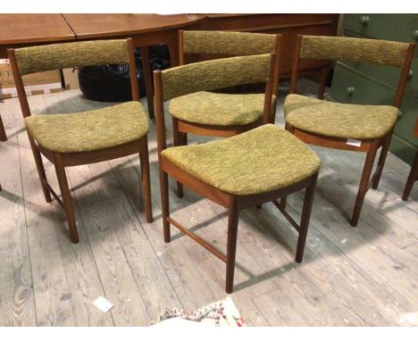 A set of four Mackintosh model no.9533 chairs, with curved back rests above upholstered seats, on turned supports united by s