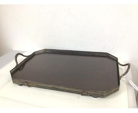 A 1930s/40s Epns drinks tray with raised handles and pierced gallery, with mahogany panel base with glass above, on bracket f