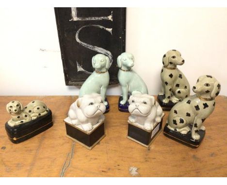 A group of ceramic dog ornaments including two celadon green dogs, stamped Librasco, Japan to base (20cm), a similar pair of 