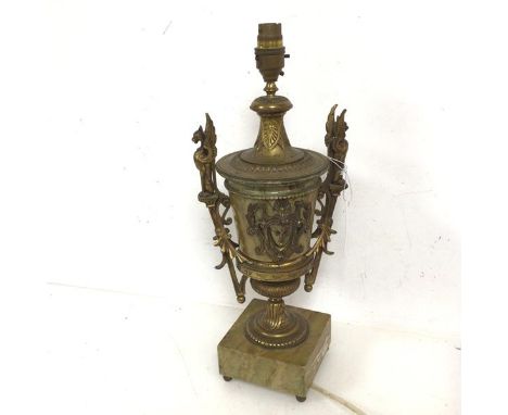 A classically inspired gilt metal and stone effect table lamp of urn form with griffin handles to sides, on square base and b