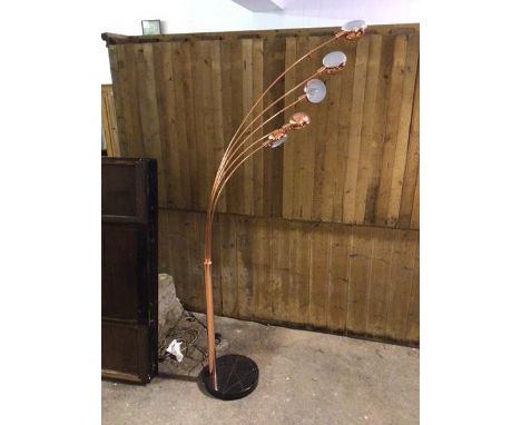 A contemporary floor lamp with copper effect body and five shades, on a stone exterior base (225cm)