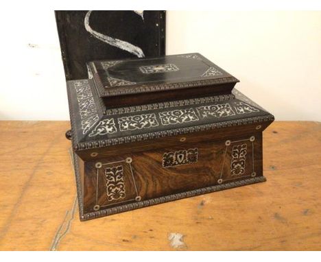 A 19thc Anglo Indian rosewood sarcophagus shaped casket with mother of pearl inlay and beaded edges, some losses to beading, 