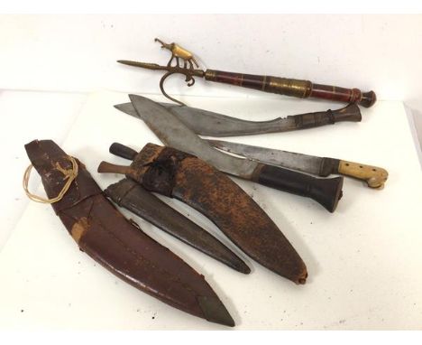 Two WWII period kukris, in leather scabbards and a bone handled steel blade Dah style dagger and scabbard and an elephant goa