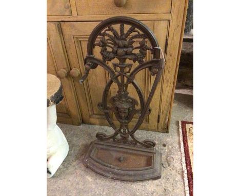 A Victorian cast metal stick stand with cornucopia pierced splat above a female portrait (rail a/f) (82cm x 43cm x 18cm)