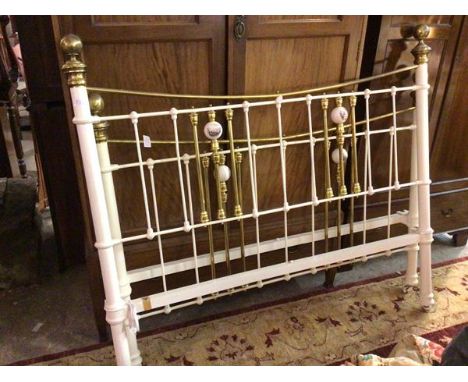 A Victorian style white painted and brass mounted spar end bed with decorative ceramic ball finials, complete with headboard,