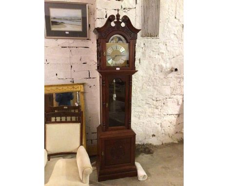 A Chinese cherrywood longcase reproduction clock, the swan neck pediment above a glazed panel arched door, with silvered bras