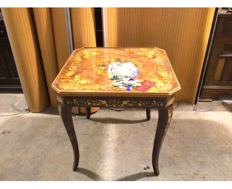 An Italian Sorrento games table, with foliate decorated exterior, includes chequerboard, backgammon, baize card table surface