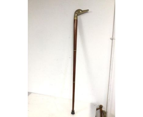 An early 20thc tipple cane with brass goose head finial which unscrews to an internal drinking vessel in the form of a tube (