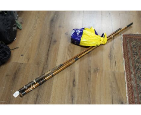 Parts of three bamboo and split cane fishing rods, one Army &amp; Navy, and bag of reels