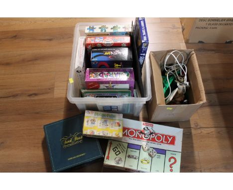 Two boxes of board games, Charades, Monopoly, Trivial Pursuit, lamp base, toys etc