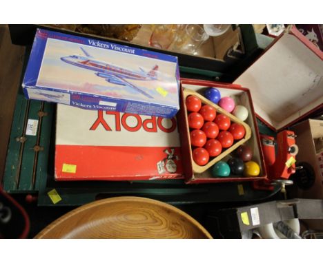 Chad Valley bagatelle board, Vulcan Minor child's sewing machine, vintage Monopoly, snooker ball set and model plane  