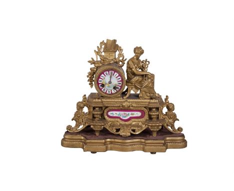 A 20TH CENTURY FRENCH STYLE GILT METAL MANTLE CLOCK, with porcelain mounts, the inset circular porcelain dial adjacent to sea