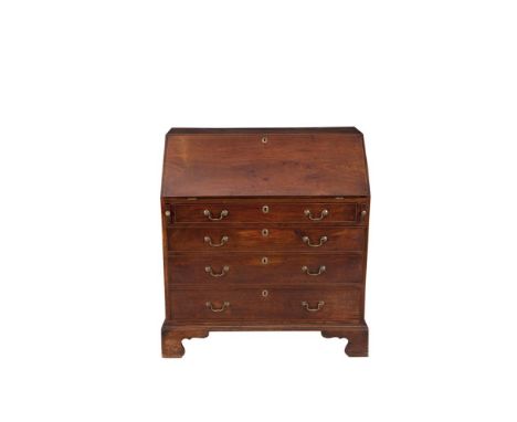 A GEORGE III MAHOGANY SLOPE FRONT BUREAU, the fall front opening to reveal a fitted interior with tooled leather scriver, pig