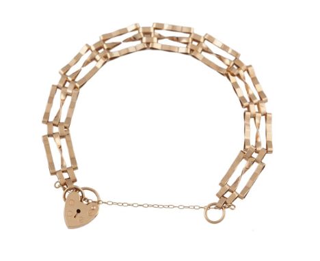 A GOLD BRACELET The gold gate-link bracelet with a heart-shaped padlock clasp and security chain, mounted in 9K gold, approxi
