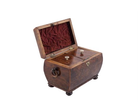 A GEORGE IV BIRD'S EYE WALNUT TEA CADDY, of rectangular bombé form, with facetted lid opening to reveal a two compartment int