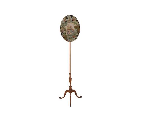 A GEORGE III SATINWOOD POLE SCREEN, with oval needlework panel decorated with birds in landscape and raised on a slender tape