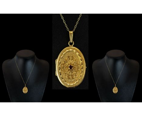18ct Gold Oval Shaped Ruby Set Hinged Ornate Locket of Excellent Workmanship, With Matched Later 9ct Gold Chain. Locket Marke