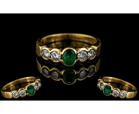 18ct Gold Attractive 5 Stone Emerald and Diamond Set Ring, Of Pleasing Design. Marked 18ct - 750 to Interior of Shank. The Na