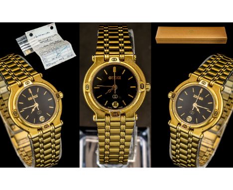 Gucci Ladies Gold Plated Deluxe Wrist Watch. Ref No 9200-L. Features Black Dial, Gold Markers, Seconds Sweep, Date-Just Windo