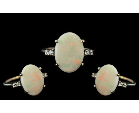 Opal Ring Set In White Gold. Large Opal Approx 10 Ct, Set In White Gold. Fully Hallmarked for Gold. Ring Size M. 