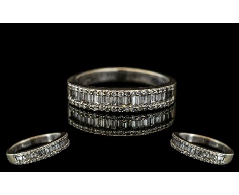 18ct White Gold - Attractive Brilliant and Baguette Cut Diamond Half Eternity Ring. Full Hallmark for 750 - 18ct. The Well Ma