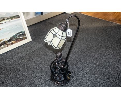 Reproduction Tiffany Style Lamp, cream petal shaped shade with base depicting a boy and girl sitting in a wheelbarrow.  Model