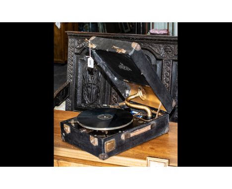 A Decce 85 Portable Record Player Crank Driven together with a collection of records. 
