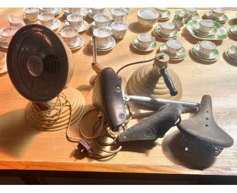 A collection of heat lamps and bicycle saddles, The barber polykmatic vintage heat generator, pifco red and radiant heat lamp